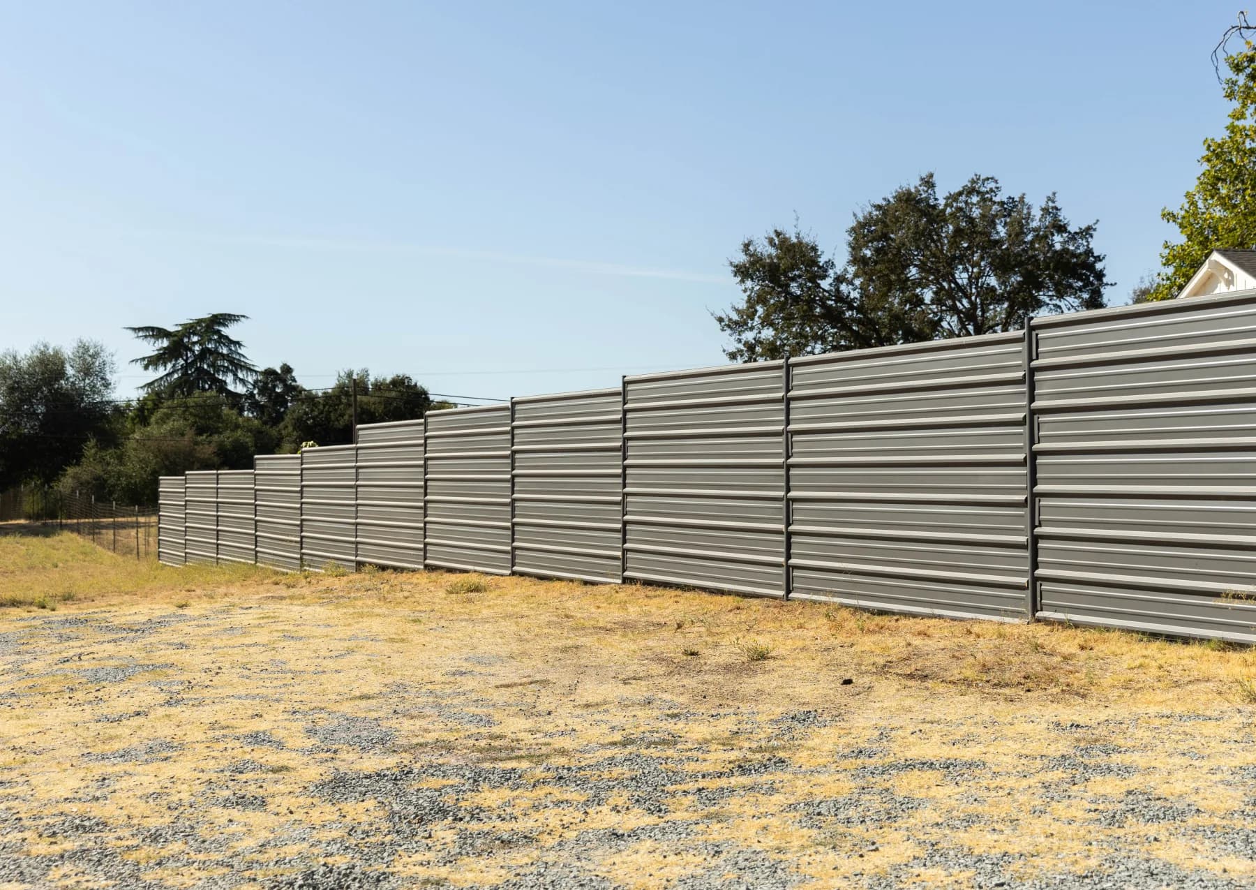 A custom wood-and-steel driveway gate