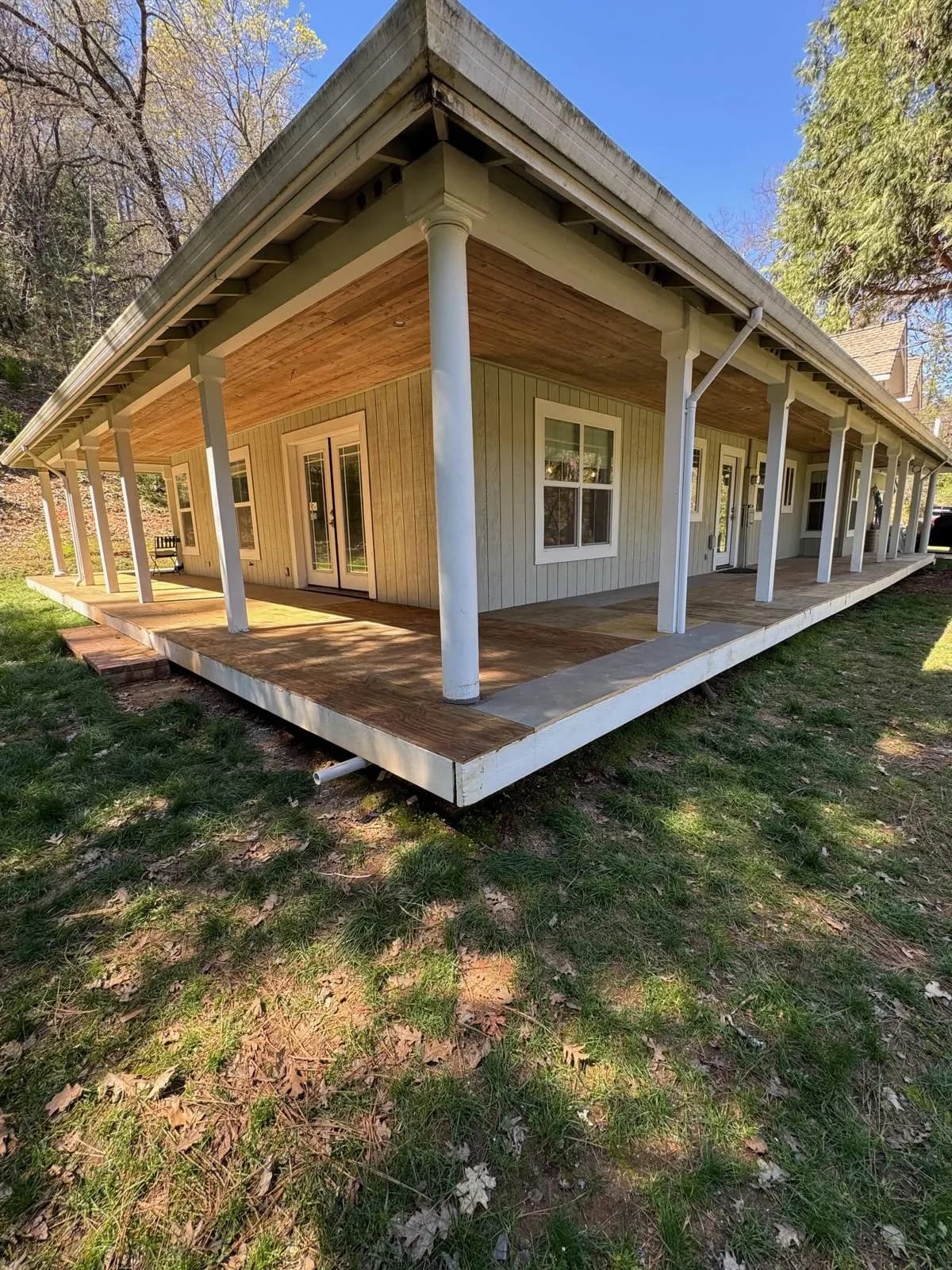 A wraparound covered deck on a home